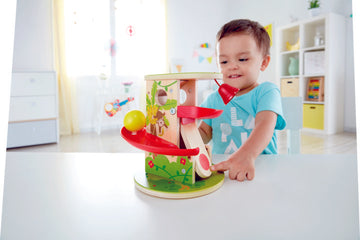 Hape Jungle Press and Slide first toys for toddlers encourage coordination, dexterity, imagination, and simple problem solving. The Toy Wagon