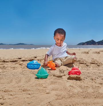 Hape Travel Sand Mold Set perfect for the sand or backyard play with quality outdoor toys The Toy Wagon