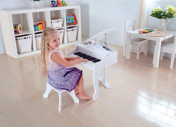 Hape Deluxe White Grand Piano a great first musical instrument for children The Toy Wagon