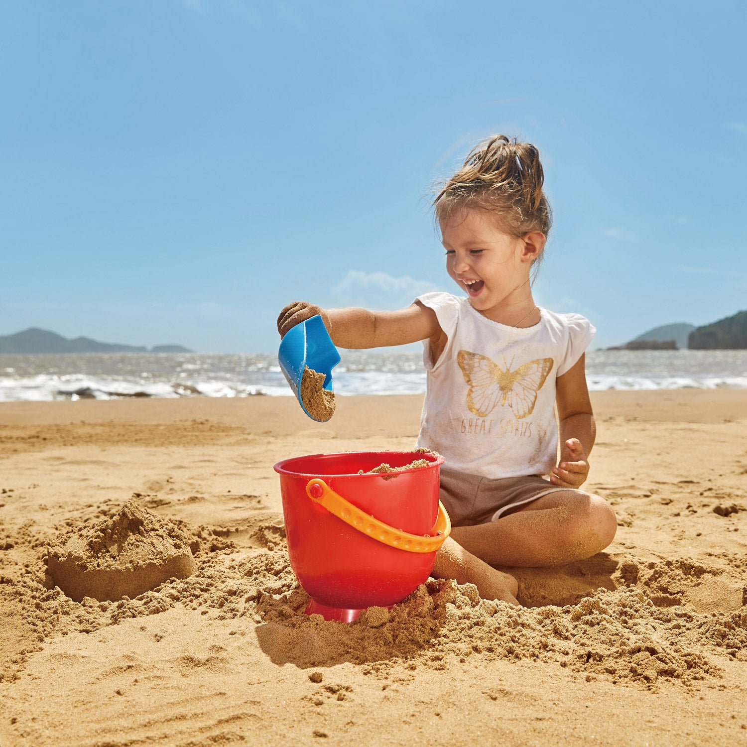 Hape Scoop & Pail perfect for the sand or backyard play with quality outdoor toys The Toy Wagon
